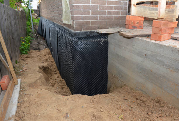 Happy homeowners after waterproofing job in Sargent